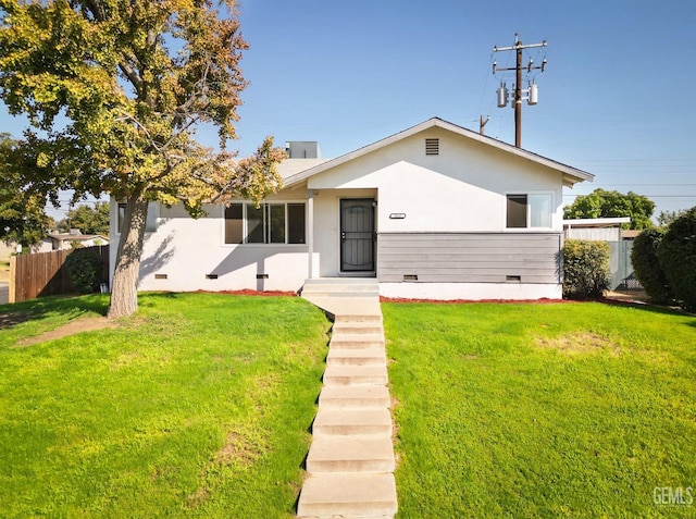 view of front of home with a front lawn