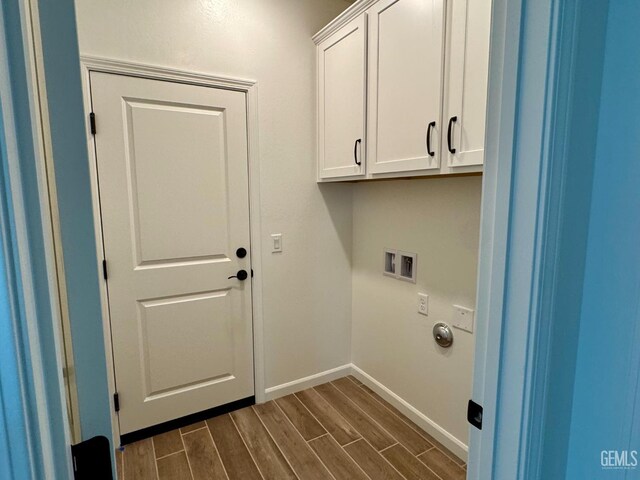 2411 Addlington St, Bakersfield, CA 93311 - laundry room with cabinet space, dark wood-style floors, and washer hookup