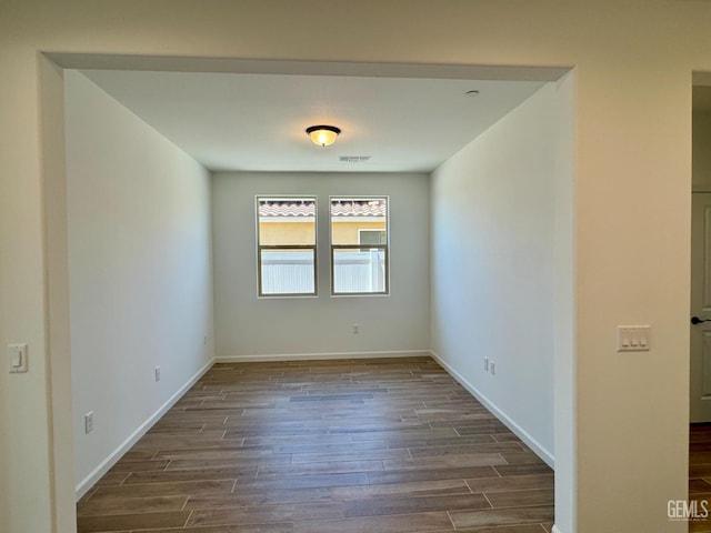 2411 Addlington St, Bakersfield, CA 93311 - unfurnished room with dark wood-style flooring