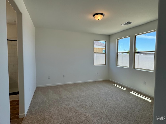 2411 Addlington St, Bakersfield, CA 93311 - empty room with carpet flooring and baseboards