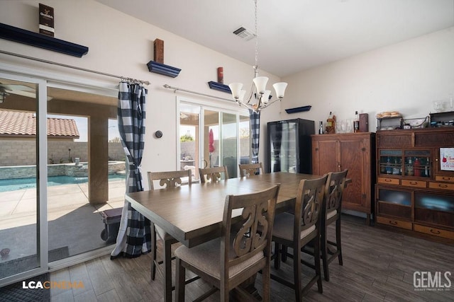 9311 Caliente Creek Ct, Bakersfield, CA 93311 - dining room featuring a chandelier and wood finished floors