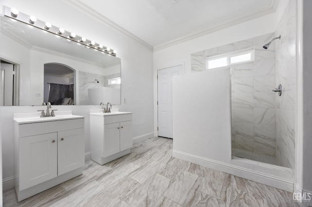 full bathroom with a sink, two vanities, a walk in shower, and crown molding