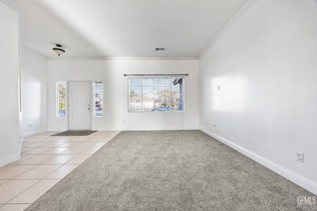 entrance foyer with light carpet, crown molding, visible vents, and light tile patterned floors