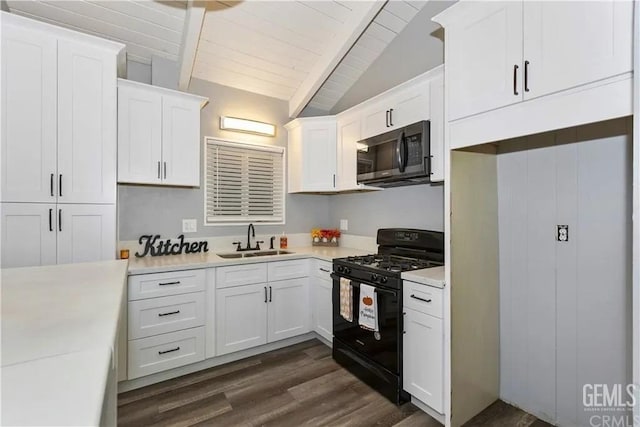 kitchen with black range with gas stovetop, white cabinetry, and sink