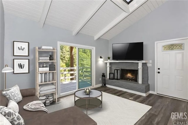 living room with beam ceiling, dark hardwood / wood-style floors, and high vaulted ceiling