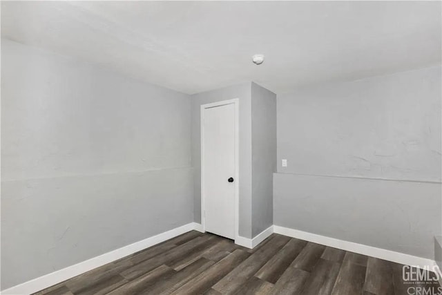 unfurnished room featuring dark hardwood / wood-style floors