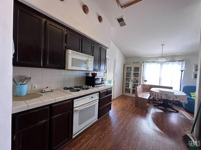 325 Terriwood Ave, Bakersfield, CA 93308 - kitchen with pendant lighting, white appliances, dark hardwood / wood-style floors, tasteful backsplash, and tile counters