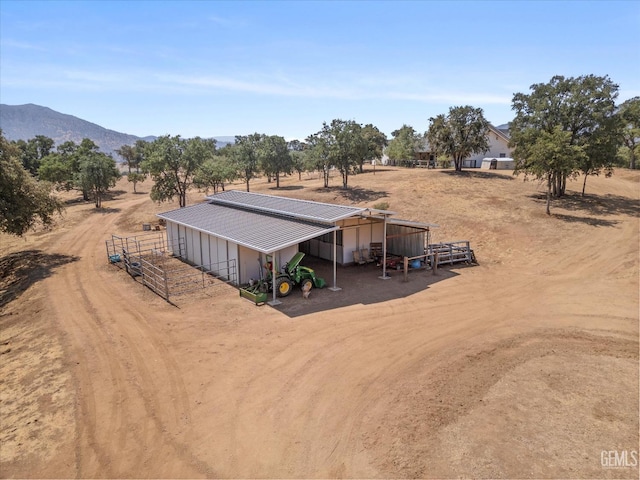 drone / aerial view featuring a mountain view and a rural view