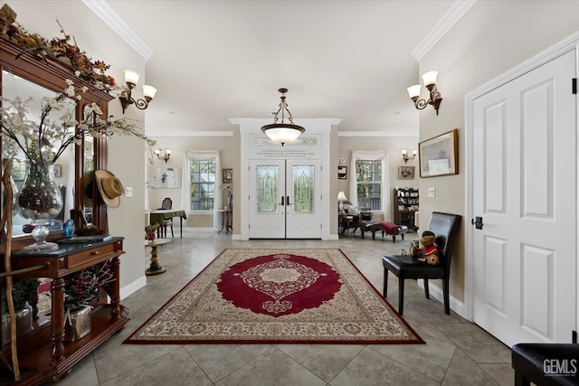 tiled entrance foyer with crown molding and french doors