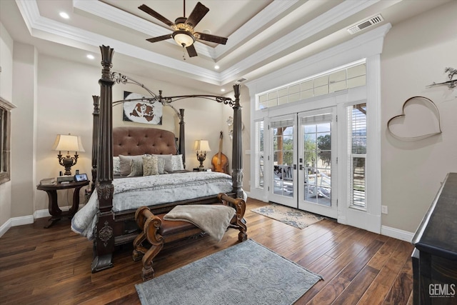 bedroom featuring a raised ceiling, ceiling fan, dark hardwood / wood-style floors, and access to outside