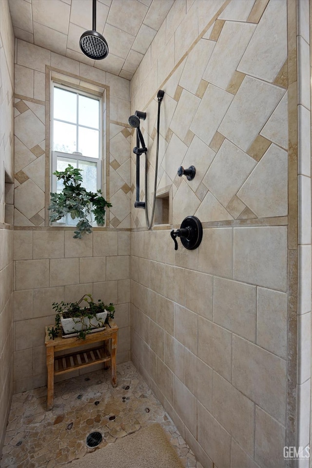 bathroom with tiled shower