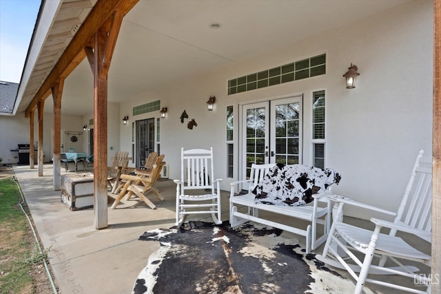 view of patio / terrace featuring a grill and french doors