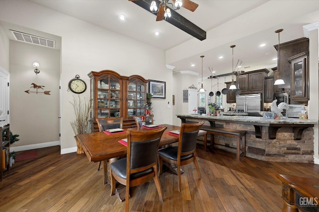 dining space with beam ceiling, ceiling fan, and dark wood-type flooring