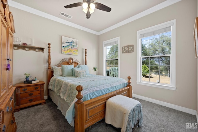 bedroom with ceiling fan, dark carpet, crown molding, and multiple windows