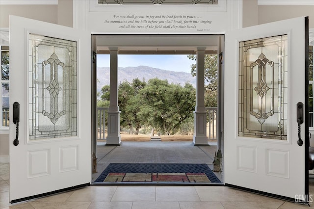 tiled entrance foyer featuring a mountain view