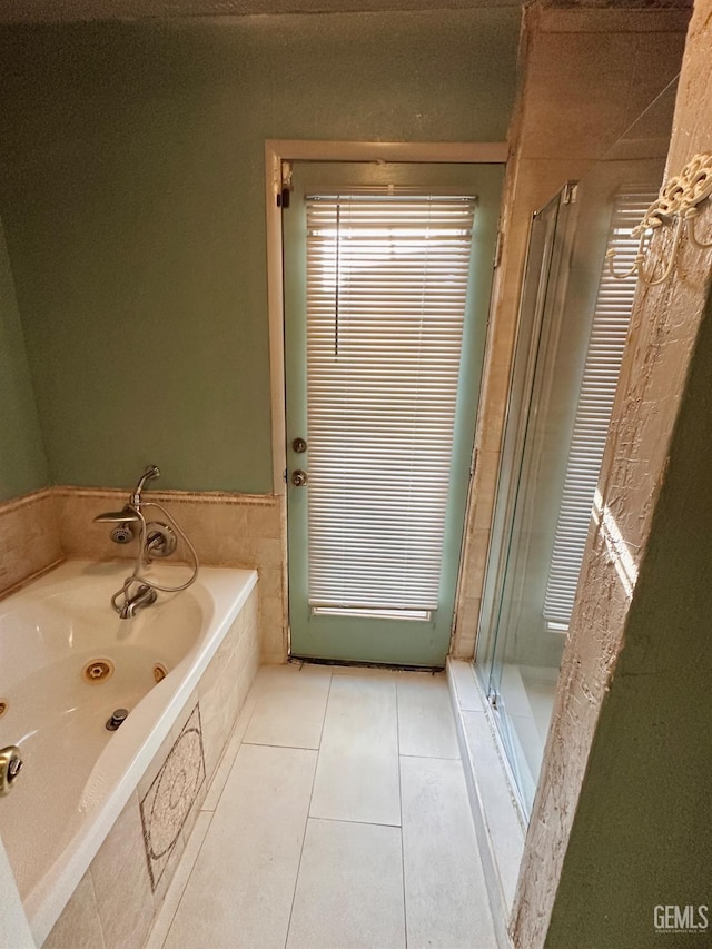 bathroom with tile patterned floors and plus walk in shower