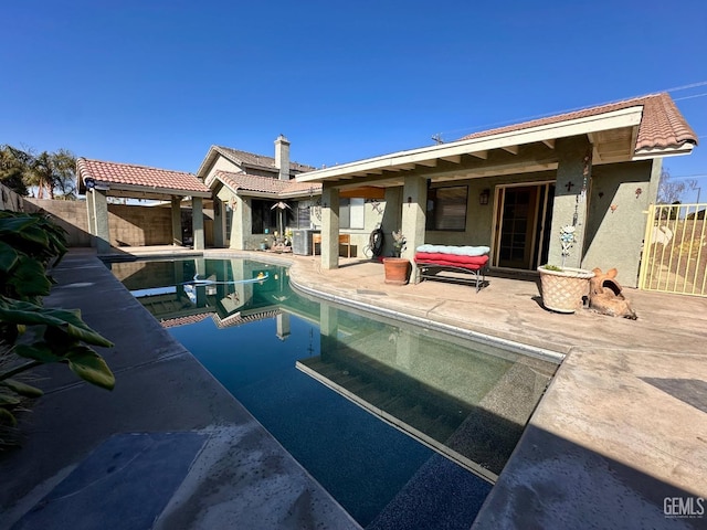 view of swimming pool with a patio area