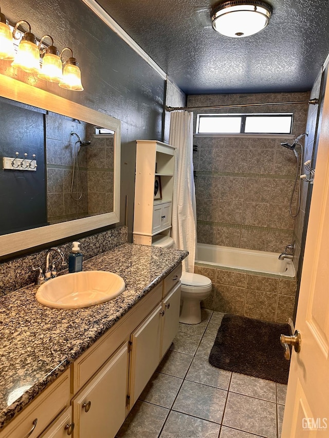 full bathroom with shower / bath combination with curtain, vanity, tile patterned flooring, and a textured ceiling