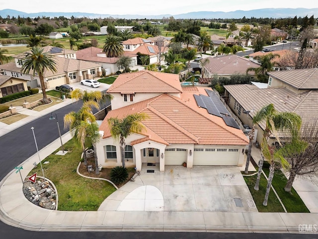 birds eye view of property with a residential view