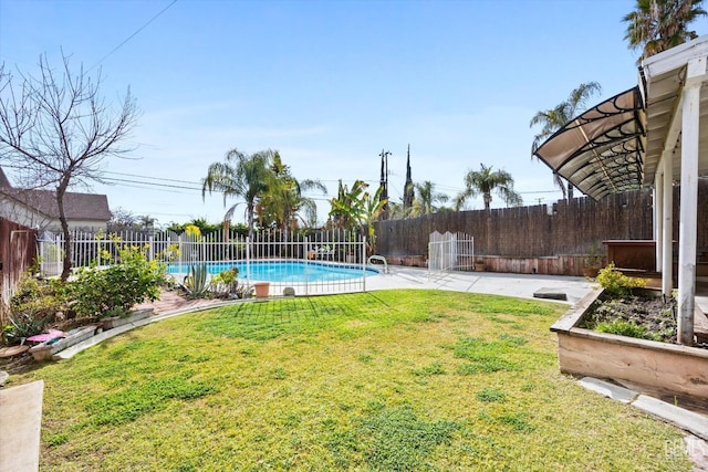 view of yard with a fenced in pool and a patio area