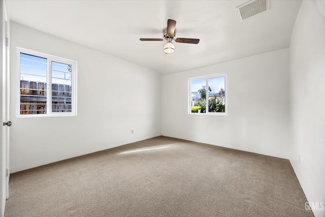 carpeted empty room with ceiling fan