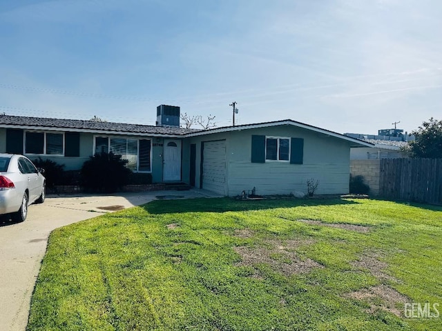 single story home with driveway, an attached garage, fence, central air condition unit, and a front yard