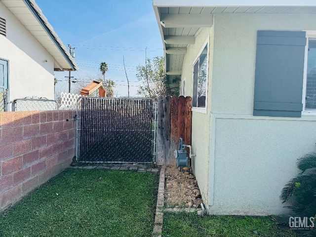 view of gate featuring fence