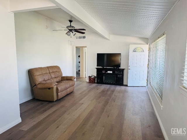 living room with vaulted ceiling with beams, visible vents, a ceiling fan, wood finished floors, and baseboards