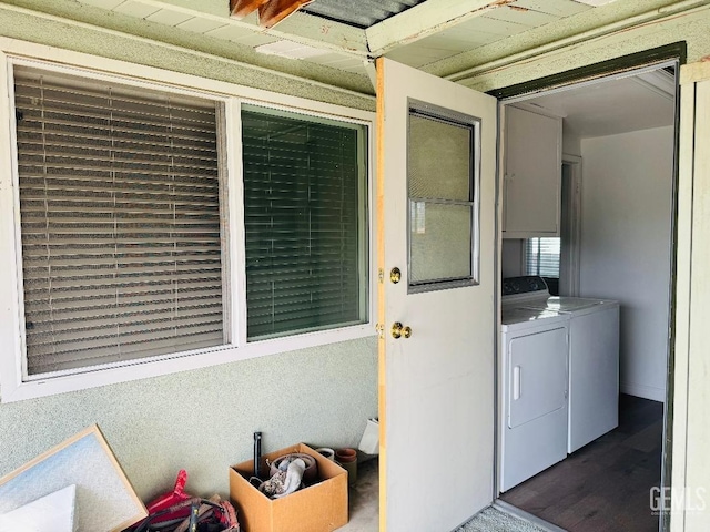 entrance to property with washing machine and clothes dryer