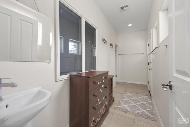 bathroom featuring tile patterned flooring and sink