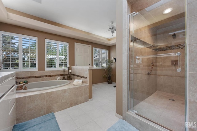 bathroom featuring plus walk in shower, tile patterned flooring, and ceiling fan