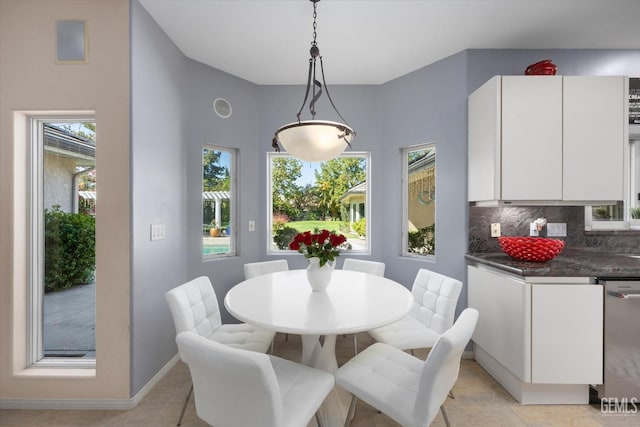 dining area featuring light tile patterned flooring