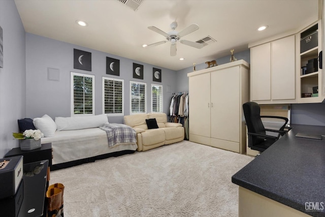 carpeted bedroom with ceiling fan