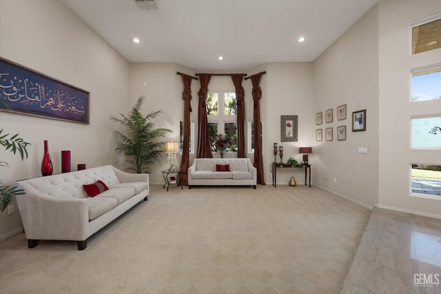 living room with a high ceiling