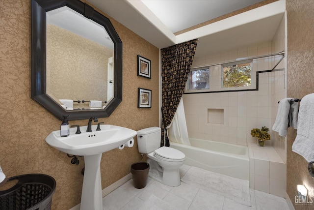 full bathroom featuring sink, tile patterned flooring, shower / bathtub combination with curtain, and toilet