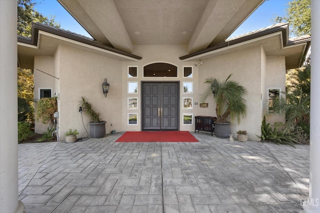 property entrance featuring a patio area