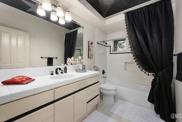 full bathroom with tile patterned floors, shower / tub combo with curtain, vanity, and toilet