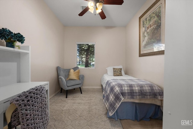 bedroom featuring ceiling fan and light colored carpet