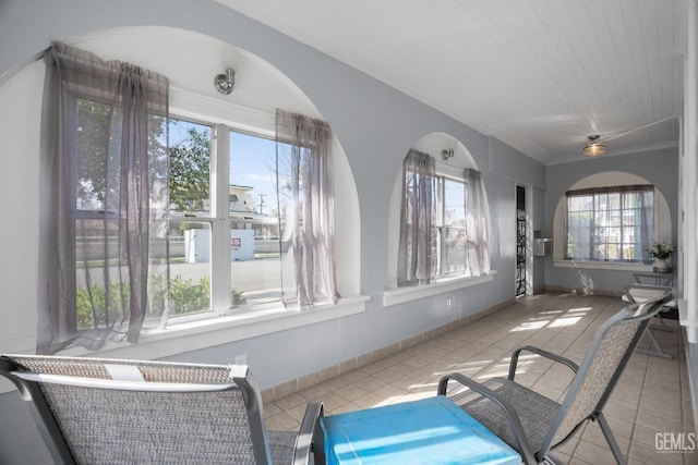 sitting room with tile patterned flooring and baseboards