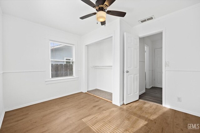 spare room featuring ceiling fan and wood-type flooring