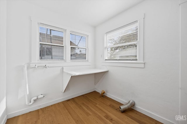 laundry area featuring hardwood / wood-style floors