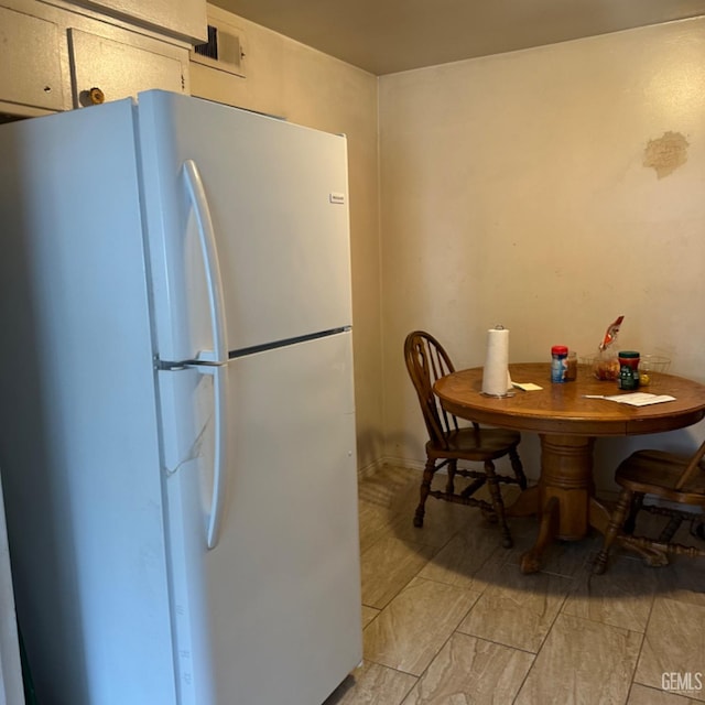 kitchen featuring white fridge