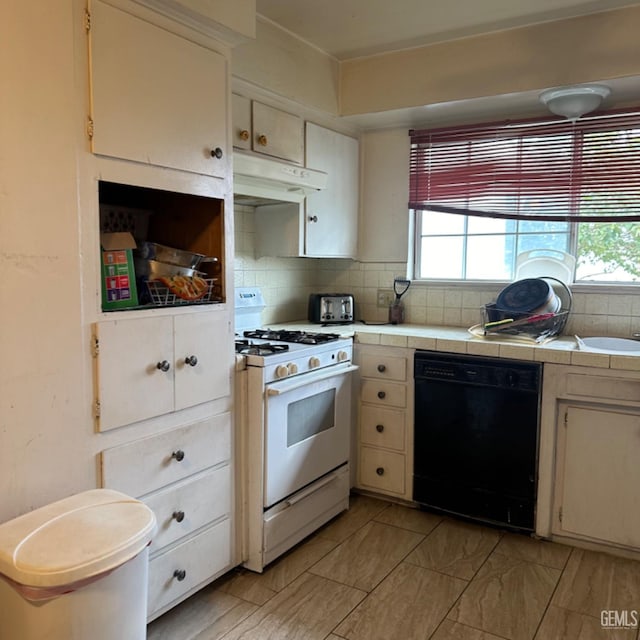 kitchen featuring dishwasher, tasteful backsplash, tile countertops, white cabinets, and white gas range oven