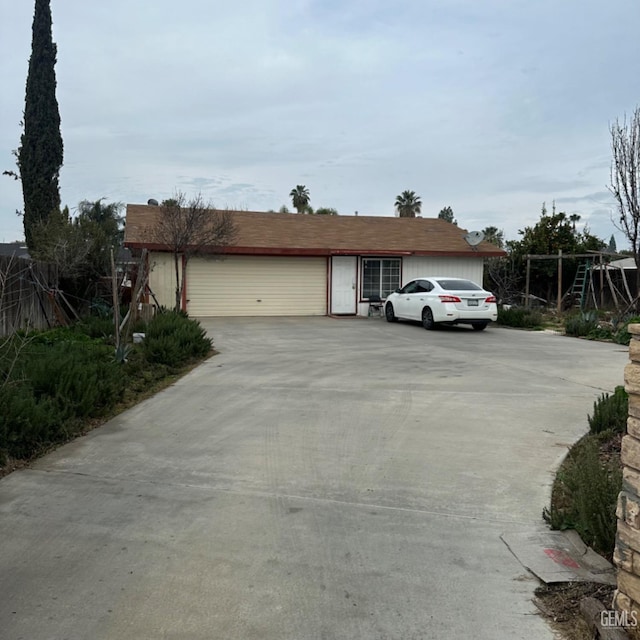 ranch-style home featuring a garage