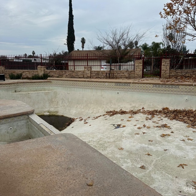 exterior space featuring an empty pool