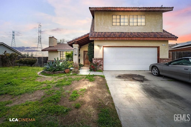 11705 Cactus Dr, Bakersfield, CA 93312 - view of front of home with concrete driveway, an attached garage, stucco siding, a chimney, and brick siding