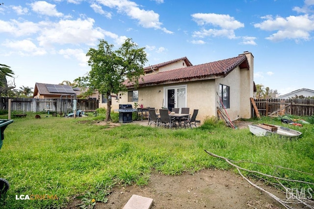 11705 Cactus Dr, Bakersfield, CA 93312 - rear view of house with stucco siding, a chimney, and a tiled roof