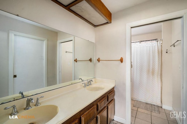 11705 Cactus Dr, Bakersfield, CA 93312 - full bath with double vanity, tile patterned flooring, baseboards, and a shower with shower curtain