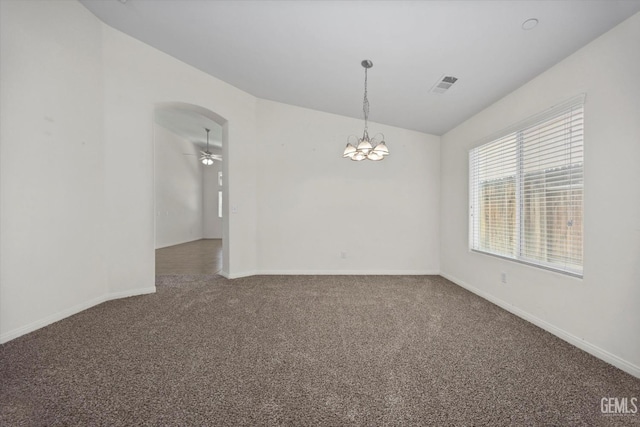 unfurnished room with visible vents, arched walkways, baseboards, ceiling fan with notable chandelier, and carpet