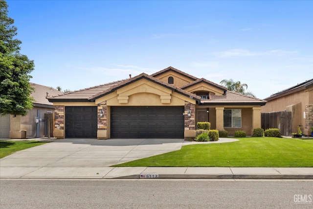 view of front of property with an attached garage, stucco siding, a tile roof, and a front lawn